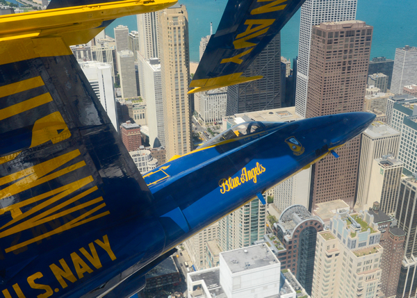 The U.S. Navy Blue Angels circle in tight formation over Chicago’s skyscrapers during the Chicago Air & Water Show. Photo courtesy City of Chicago, DCASE.
