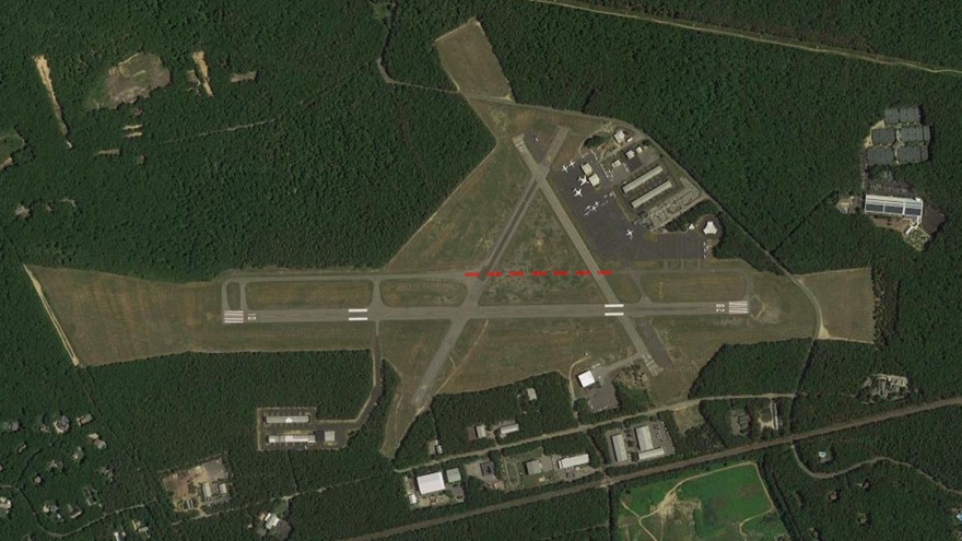 The East Hampton Airport from above with proposed path of construction shown in red. Photo courtesy of Google Earth.