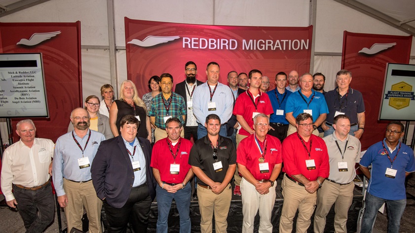 Distinguished regional flight instructor winners join AOPA President Mark Baker and You Can Fly staff members for a group photo during the 2018 AOPA Flight Training Experience Awards presentation at Redbird Migration, held at the AOPA You Can Fly Academy. Photo by Mike Collins.