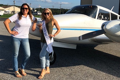 Miss New Jersey Jaime Gialloreto, seen with student pilot Lyndse Costabile, learned about drones and flew single- and twin-engine aircraft in preparation for Women in Aviation International's Girls in Aviation Day Oct. 13. Photo courtesy of Dave Krause, Influential Drones.