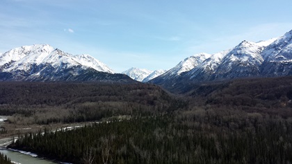 Snow-covered mountains line the Glenn Highway traveling north from Anchorage. Photo by Jason Cobb.