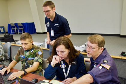 Civil Air Patrol members Isaac Vermillion, Scott Stevens, Wendy Lesesne, and Will Windham (from left to right) work through the flight planning process in the wake of Hurricane Florence at the North Carolina Wing mission base in Burlington. Photo courtesy of the Civil Air Patrol.
