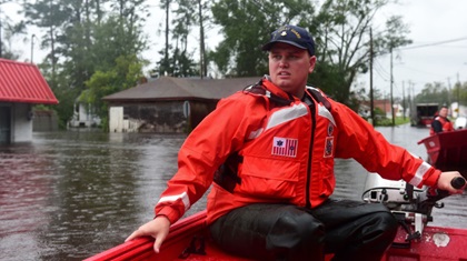 U.S. Coast Guard Petty Officer 2nd Class Gaaron Blanchard, a shallow-water response boat team member, steers a 16-foot aluminum rescue boat through floodwaters caused by Hurricane Florence in Newport, North Carolina, Sept. 15. The Coast Guard deployed 35 shallow-water response teams to assist in the rescue effort as rising waters trapped hundreds of people across the state. U.S. Coast Guard photo by Petty Officer 1st Class Seth Johnson.