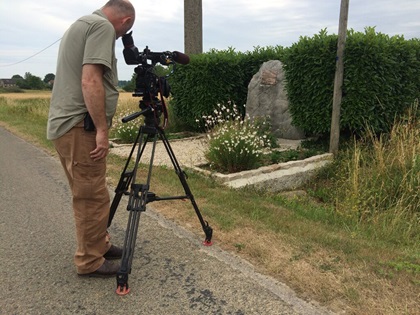 Director of Photography Mathieu Mazza films the crash site marker of James McConnell near Flavy-la-Martel, France. Photo by Paul Glenshaw.