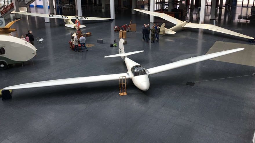 Vintage gliders are exhibited in the lobby of the convention center (counterclockwise: Gö4/1952, Gö3 Minimoa/1938, Gö1 Wolf/1935). Photo by Sylvia Horne.