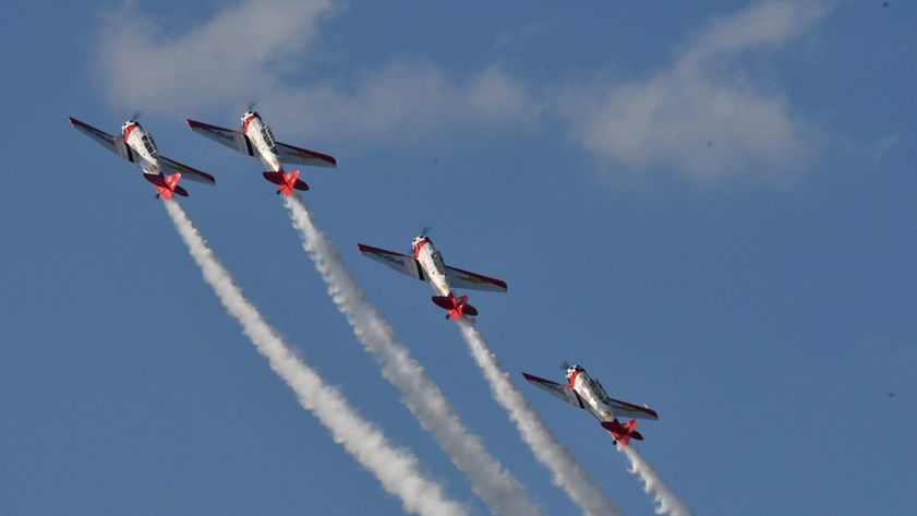 The Aeroshell Aerobatic Team climbs into its next maneuver during an airshow at the 2019 Sun 'n Fun International Fly-In and Expo. Photo by Mike Collins.