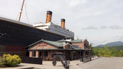 The Titanic museum attraction, shaped like the RMS Titanic and built to half scale, stands out from its gorgeous mountain backdrop. Photo by MeLinda Schnyder.