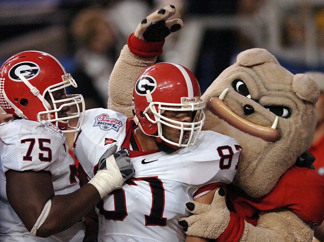 University of Georgia mascot Hairy Dog congratulates Bulldog football players after a touchdown. Photo By David Tulis.