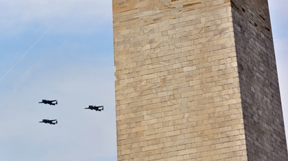 Three restored North American B-25 Mitchell medium bombers from World War II fly past the Washington Monument on the National Mall during the Arsenal of Democracy: World War II Victory Capitol Flyover on May 8, 2015. Photo by Mike Collins.