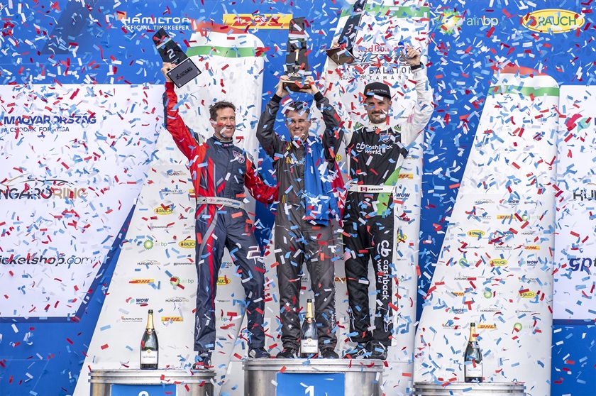 Matt Hall of Australia, center, celebrates with Ben Murphy of Great Britain and Pete McLeod of Canada, right, during the award ceremony following the Red Bull Air Race World Championship at Lake Balaton, Hungary on July 14. Photo courtesy of Joerg Mitter, Red Bull Content Pool.