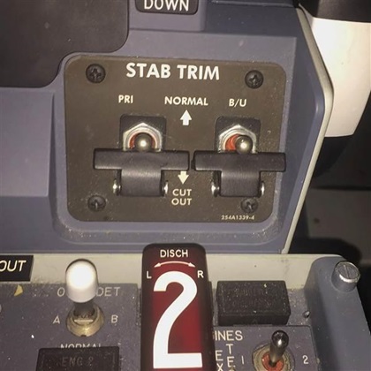 The stabilizer trim switches of a Boeing 737 Max 8 aircraft are located on the center pedestal and can be defeated by either the pilot or the first officer, according to a career pilot familiar with the aircraft. Courtesy photo.