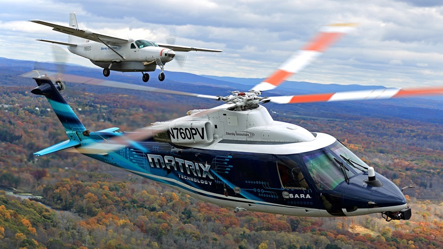 Sikorsky’s S-76 research aircraft capable of autonomous flight, foreground, is demonstrating technology that makes human pilots optional in any aircraft. Photo courtesy of Sikorsky/Lockheed Martin.