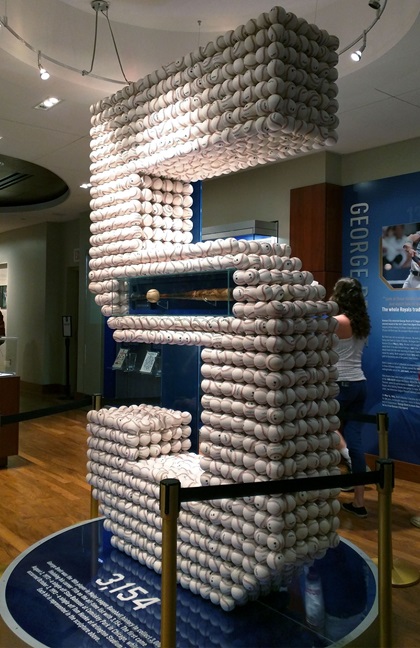 Baseball Hall of Fame inductee George Brett is memorialized at the Royals Hall of Fame Museum at Kauffman Stadium with this display of 3,154 baseballs in the shape of his uniform No. 5. That was his final hit total after a career spent entirely with the Kansas City Royals. The display also includes the bat he used to collect his 3,000th hit. Photo by MeLinda Schnyder.