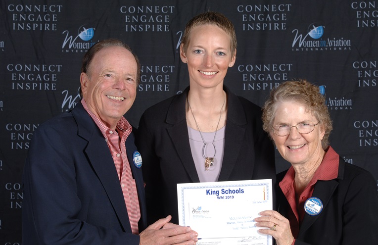 U.S. Air Force Academy graduate Melissa Martin, center, was awarded a $5,000 Martha King Scholarship for Female Flight Instructors during the 2019 Women in Aviation International Conference in March. Looking on is school co-founder John King, left. Photo courtesy of King Schools.