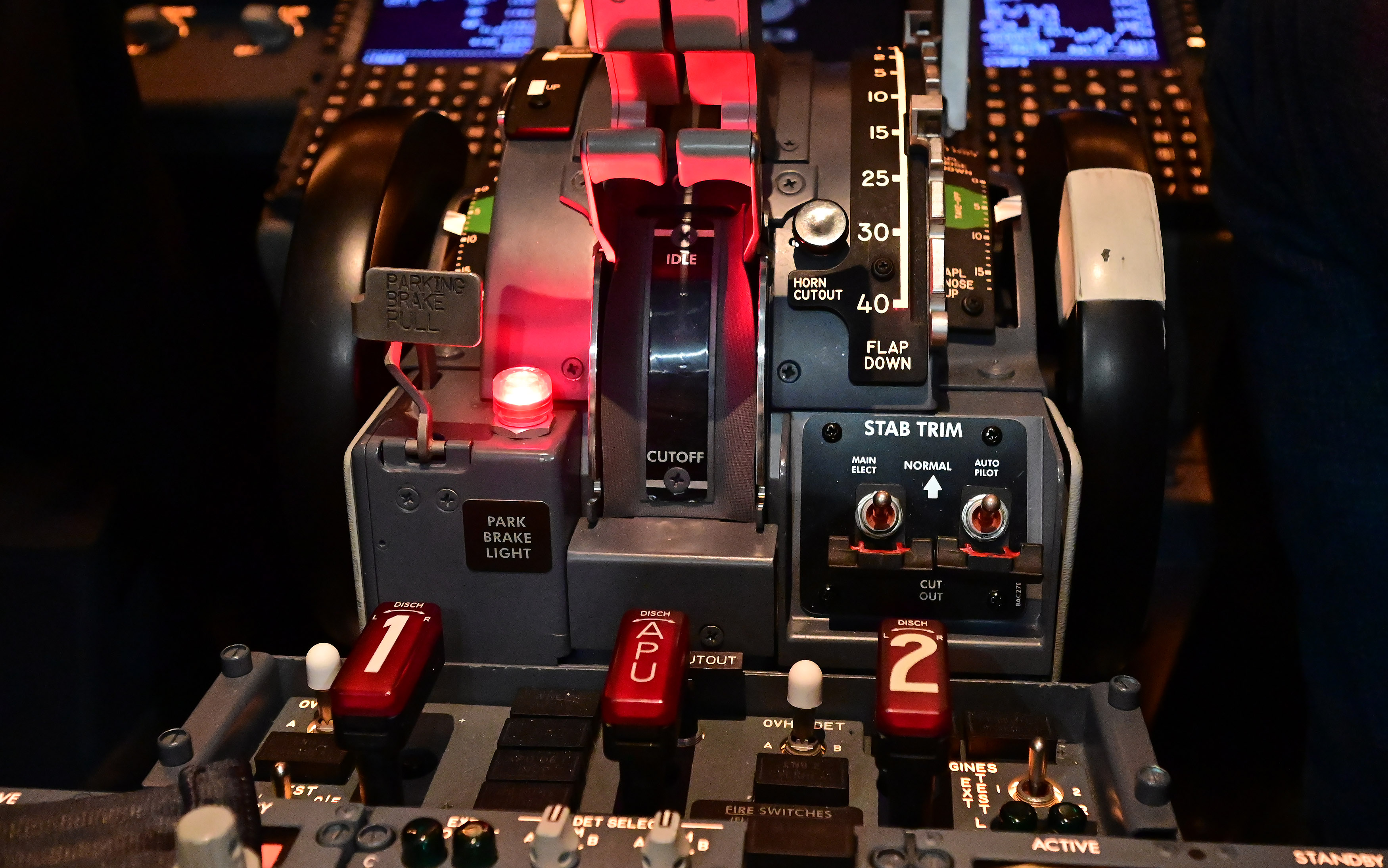 A pair of stabilizer cutoff switches occupy a prominent location on a Boeing 737 trim pedestal. Photo by David Tulis.