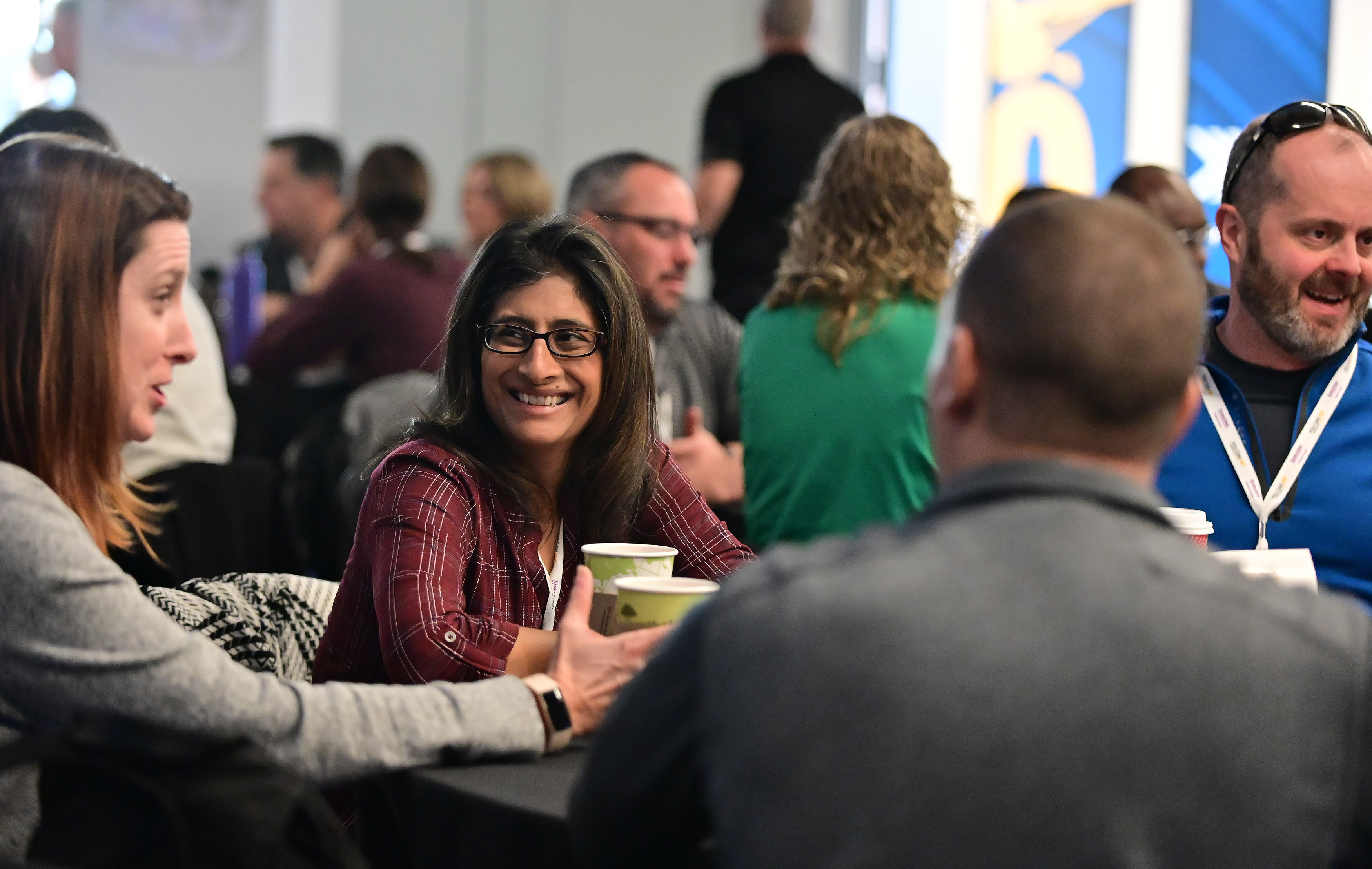 Educators socialize during the AOPA High School Aviation STEM Symposium. Photo by David Tulis.
