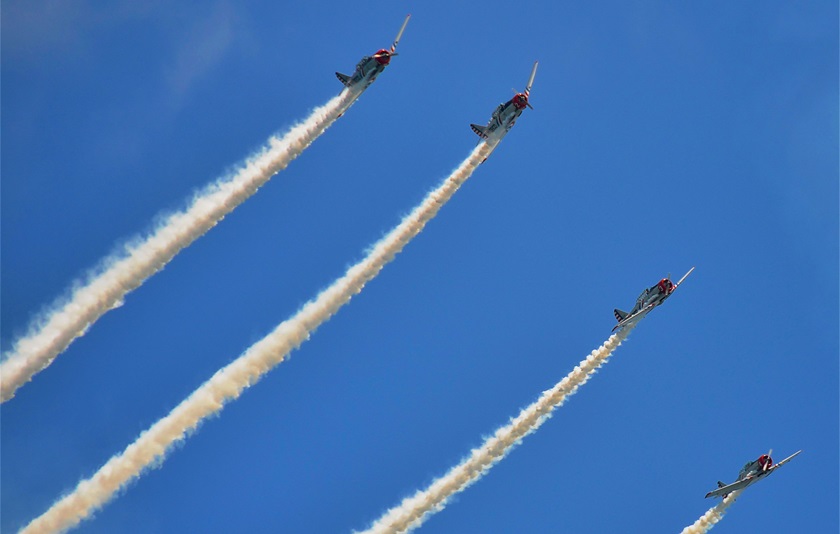 Skytypers’ well-known East Coast division flies a fleet of vintage SNJ–2s as the Geico Skytypers for airshows all over the United States. Photo by Chris Eads.