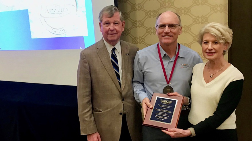 Aero Club of New England Co-President Georgia Pappas and board member Dr. Gary Kearney presented the group's Presidential Award to AOPA Air Safety Institute Executive Director Richard McSpadden (center) on March 11. Photo courtesy of David O'Leary.