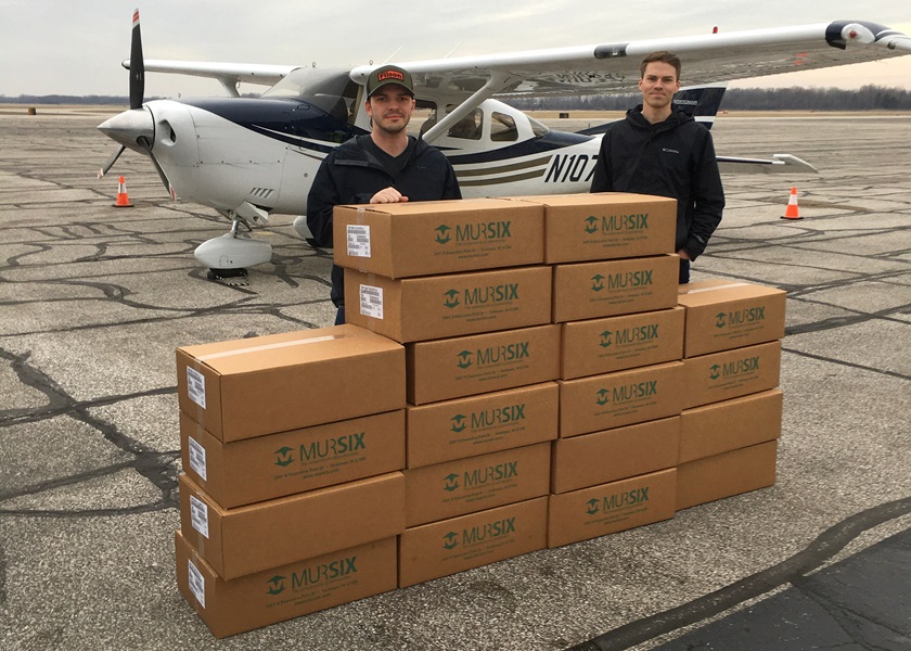 General aviation is providing vital services to the public and economy during the coronavirus pandemic, as exemplified by Michigan Seaplane flight school instructors Nick Hall and Mike Mato, who have been flying medical face shields to a Michigan hospital in a Cessna 206. AOPA and other aviation groups are requesting exemptions for GA because it is serving a critical role. Photo courtesy of Nick Hall and Mike Mato.