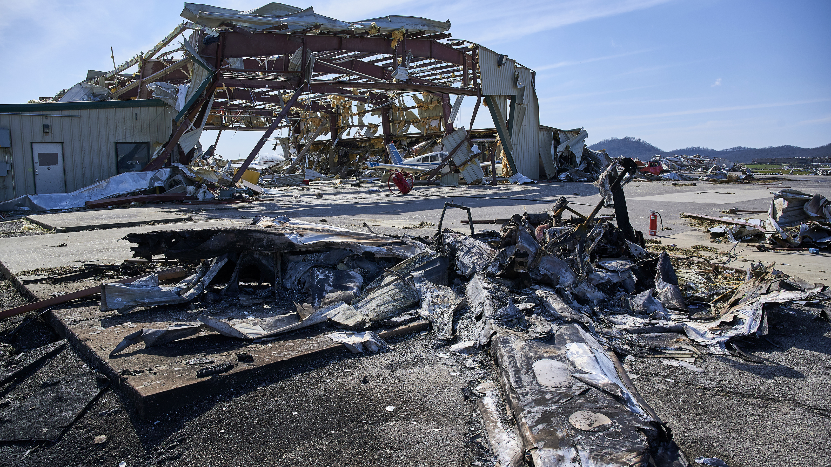 The bones of a hangar remain after a tornado ripped through John C. Tune Airport in Nashville, destroying many aircraft and buildings. Photo by Harrison McClary.