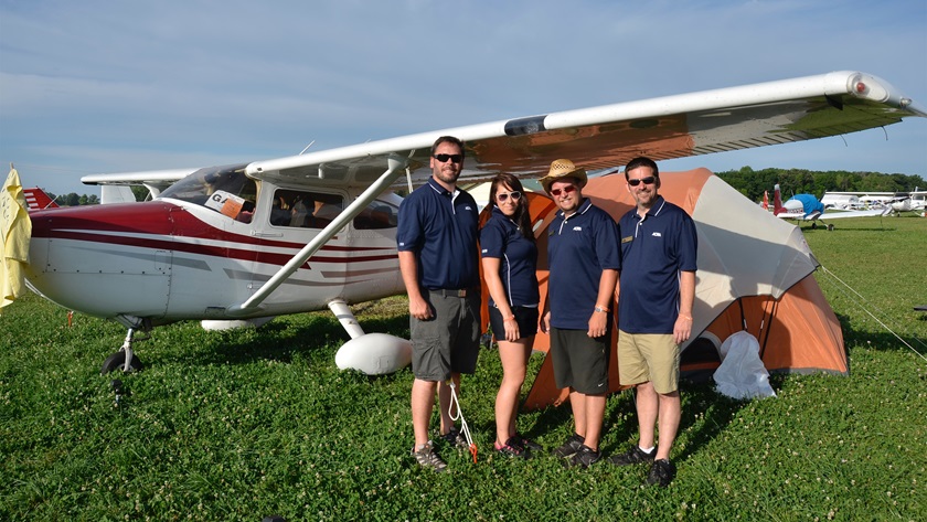 The author and fellow AOPA colleagues pitched several tents underneath a pair of Cessna 182s at EAA’s AirVenture. The trip to and from Oshkosh contained many great lessons in VFR flying. Pictured left to right, AOPA Outreach and Events leaders Dan Justman, Elizabeth O’Connell, Sean White, and Chris Eads. Photo by Chris Eads. 