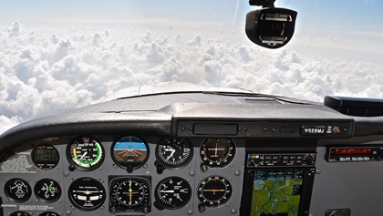 Pilots can encounter unexpected weather on long-range VFR trips. A thick cloud layer that extended well beyond the original forecast meant that this VFR-over-the-top flight segment would require either a significant diversion of many miles or an airborne IFR clearance, the latter only made possible by the proficient, current CFII on board.