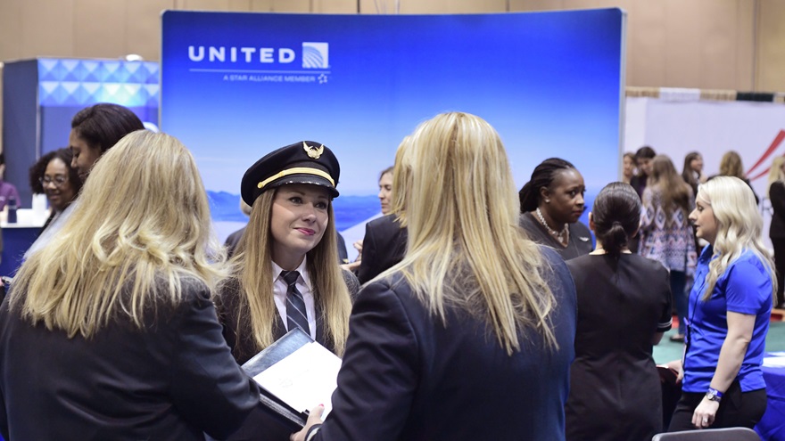 United Airlines Boeing 737 first officer Katrina Mittelstadt talks with two potential United pilot applicants during the 2018 International Women in Aviation Conference in Reno, Nevada. The 2021 WAI annual conference will be a virtual event, organizers announced. Photo by Mike Collins.