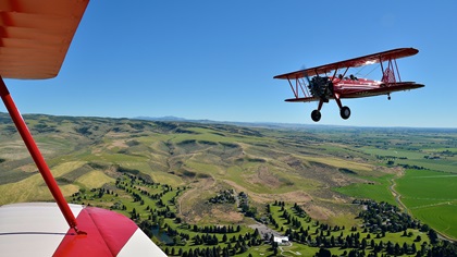 It doesn't get any better than this: A formation flight with a pair of Stearmans, led by AOPA member Bob Hoff over his private airstrip in Idaho Falls, Idaho, sealed the author's interest in formation flying. Photo by Chris Eads.