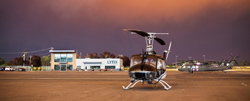 Daylight filters through smoke, illuminating helicopters based at Aurora State Airport in Aurora, Oregon, in September. Photo by Aric Krause, courtesy of Van’s Aircraft. 