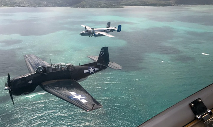 An aerial parade of warbirds flies over Pearl Harbor, Hawaii, on September 2 to celebrate the seventy-fifth anniversary of the end of World War II. Photo courtesy of KT Budde-Jones.
