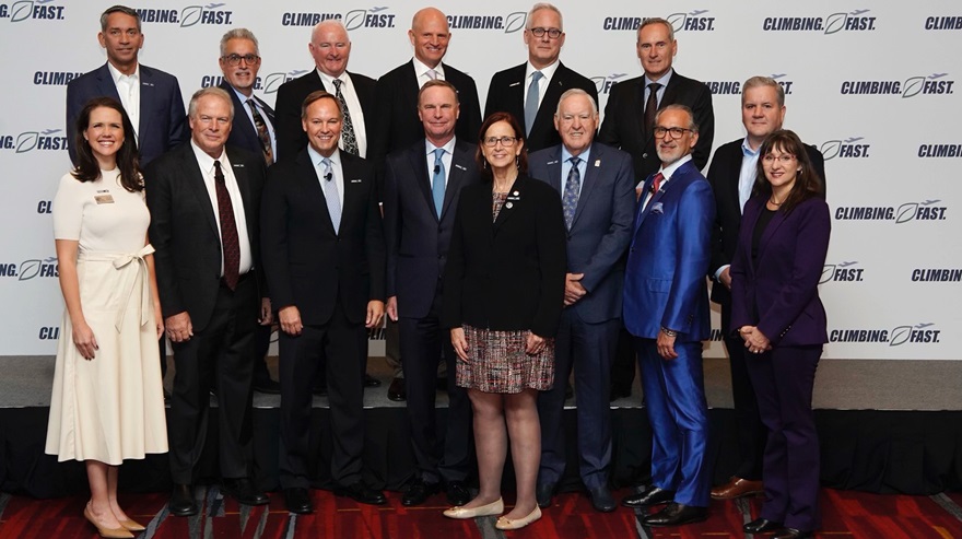                      General aviation industry stakeholders (including AOPA President Mark Baker, back row, third from left) announced a new initiative to achieve the shared goal of net-zero emissions. Photo courtesy of the National Business Aviation Association.          