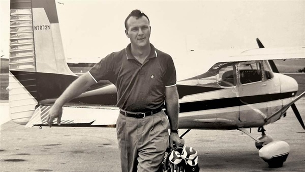 Golfing great and record-setting pilot Arnold Palmer carries his golf clubs as he exits a 1958 Cessna 175 Skylark that he leased early in his career. Photo courtesy of David Arenson/Only Classics.