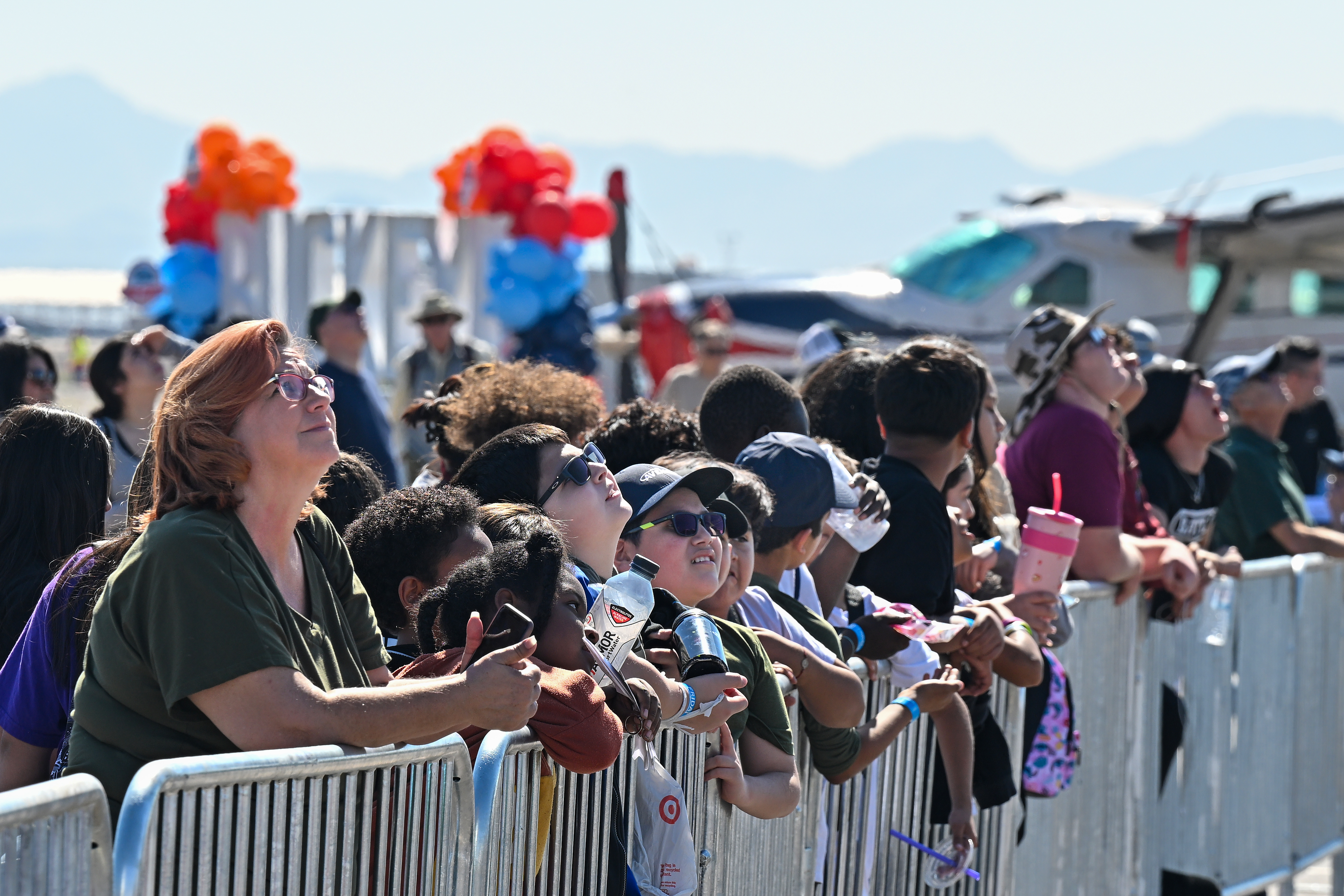Youth watch the afternoon airshow. Photo by David Tulis.
