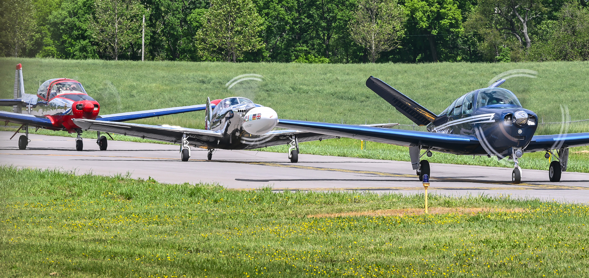 Earthrounder Adrian Eichhorn in a Beechcraft Bonanza, right, leads the way to the runway at Frederick Municipal Airport in Maryland. Photo by David Tulis.