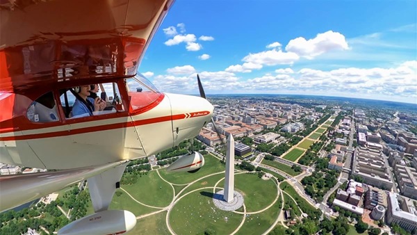 A 1953 Piper Tri-Pacer piloted by David Tulis, with brother Martin serving as safety pilot, flew with the "Boom Age" group, among 54 aircraft representing different chapters of general aviation's story to help celebrate AOPA’s eighty-fifth anniversary in Washington, D.C., on May 11. Photo by David Tulis.