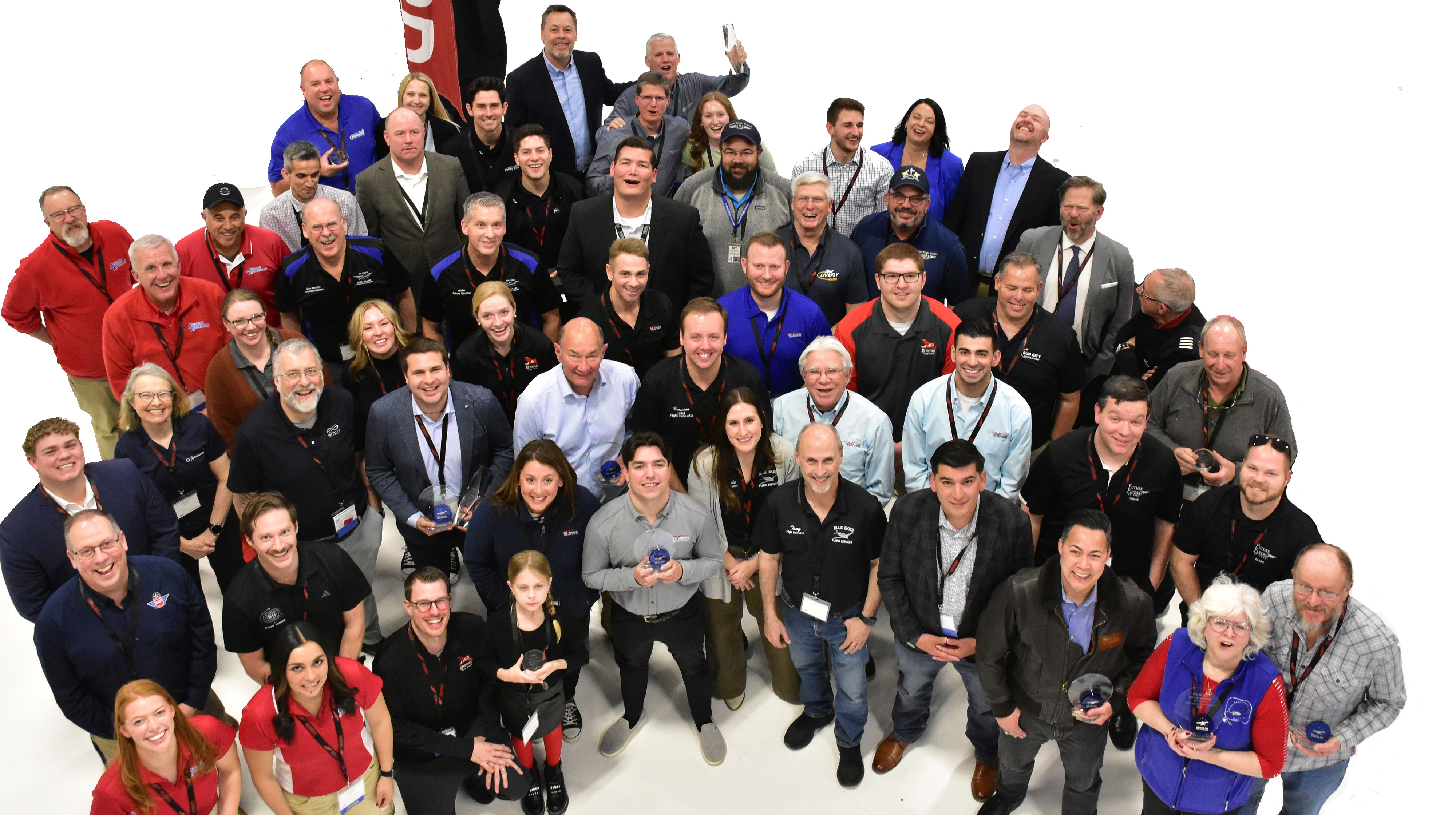 The 2025 AOPA Flight Training Experience Awards regional and national winners gathered at Redbird Migration. Photo by Stephen Schroeder.