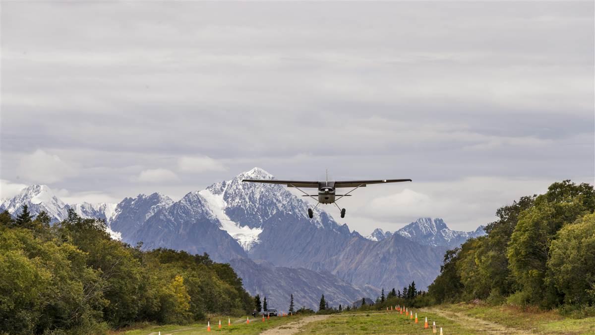 Alaskan airplanes make seasonal shifts from wheels to floats to skis. This Cessna 180 can adjust to gravel, water, or ice surfaces.