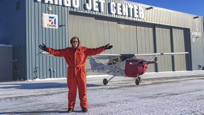 Mike Paulson, flight school manager and chief flight instructor at the Fargo Jet Center, shows off his winter flying clothes. It’s important to dress for the possibility of an off-airport landing, and a very long walk in sub-zero temperatures.