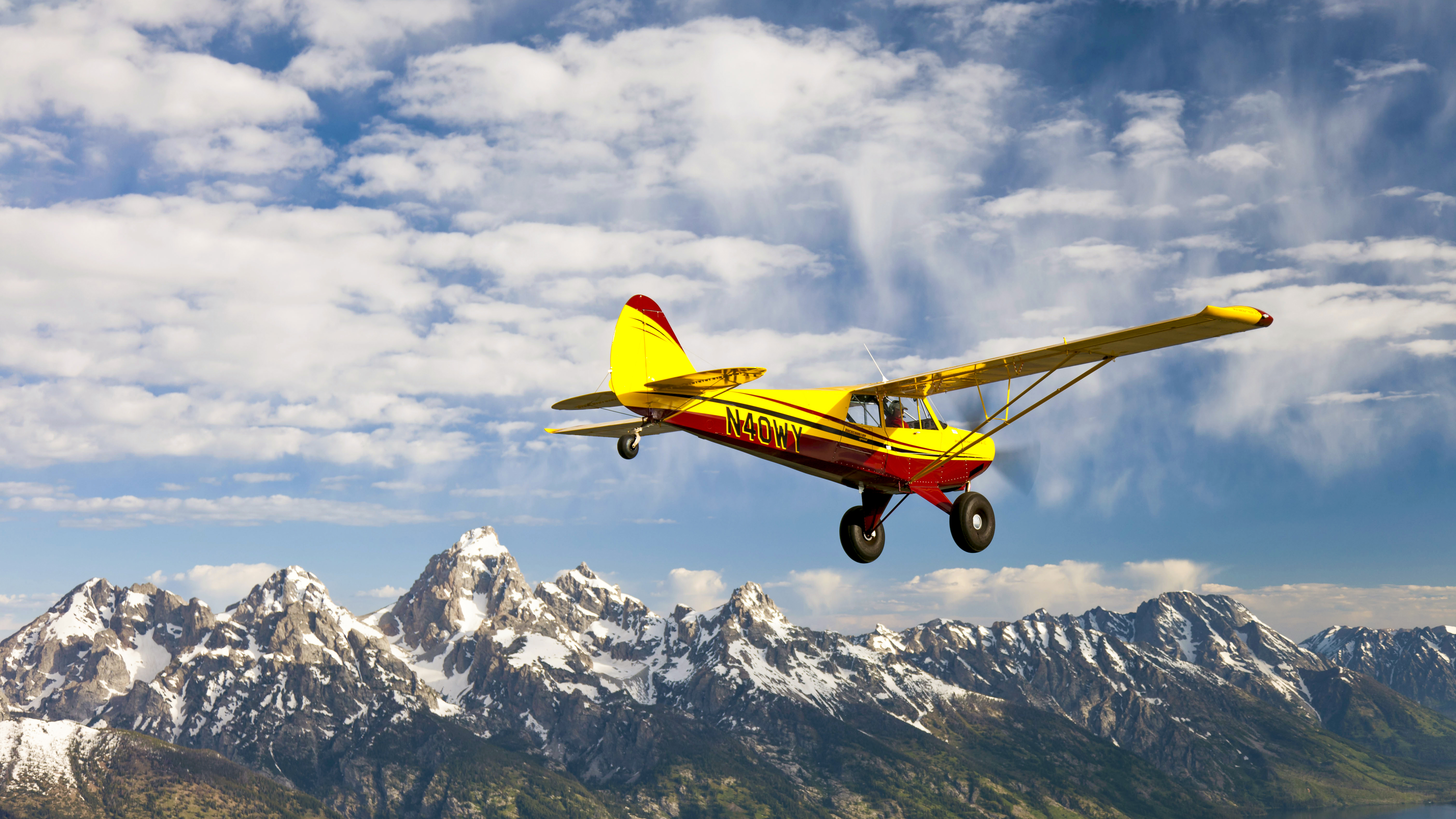 Flying along a snow-capped mountain range is beautiful, but remember that mountains can create severe weather quickly. Photography by Mike Fizer