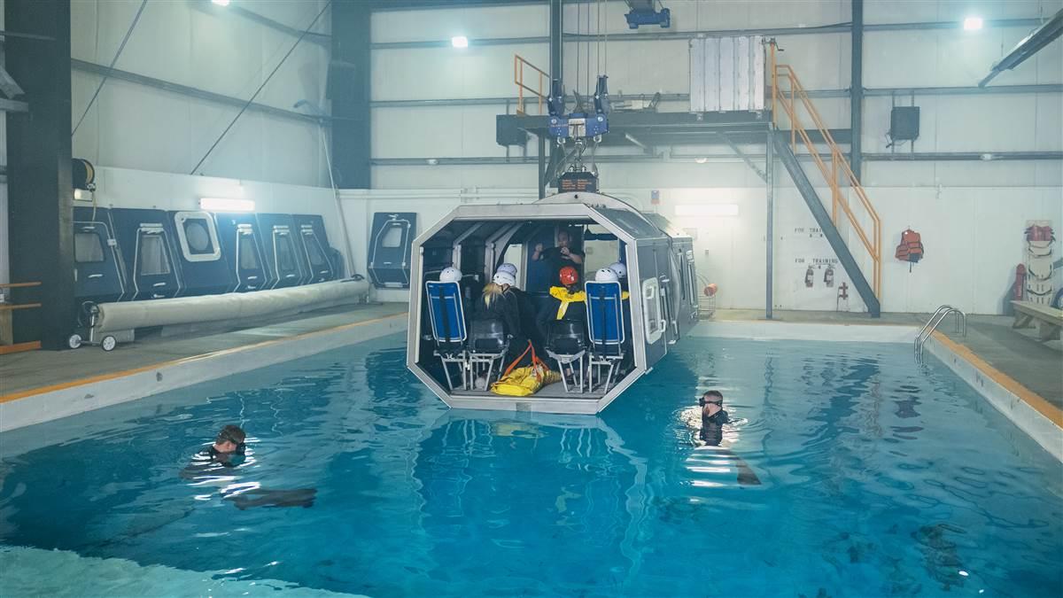 The Modular Egress Training (MET) simulator, being readied for a dunking. Students exit through side doors that jettison.