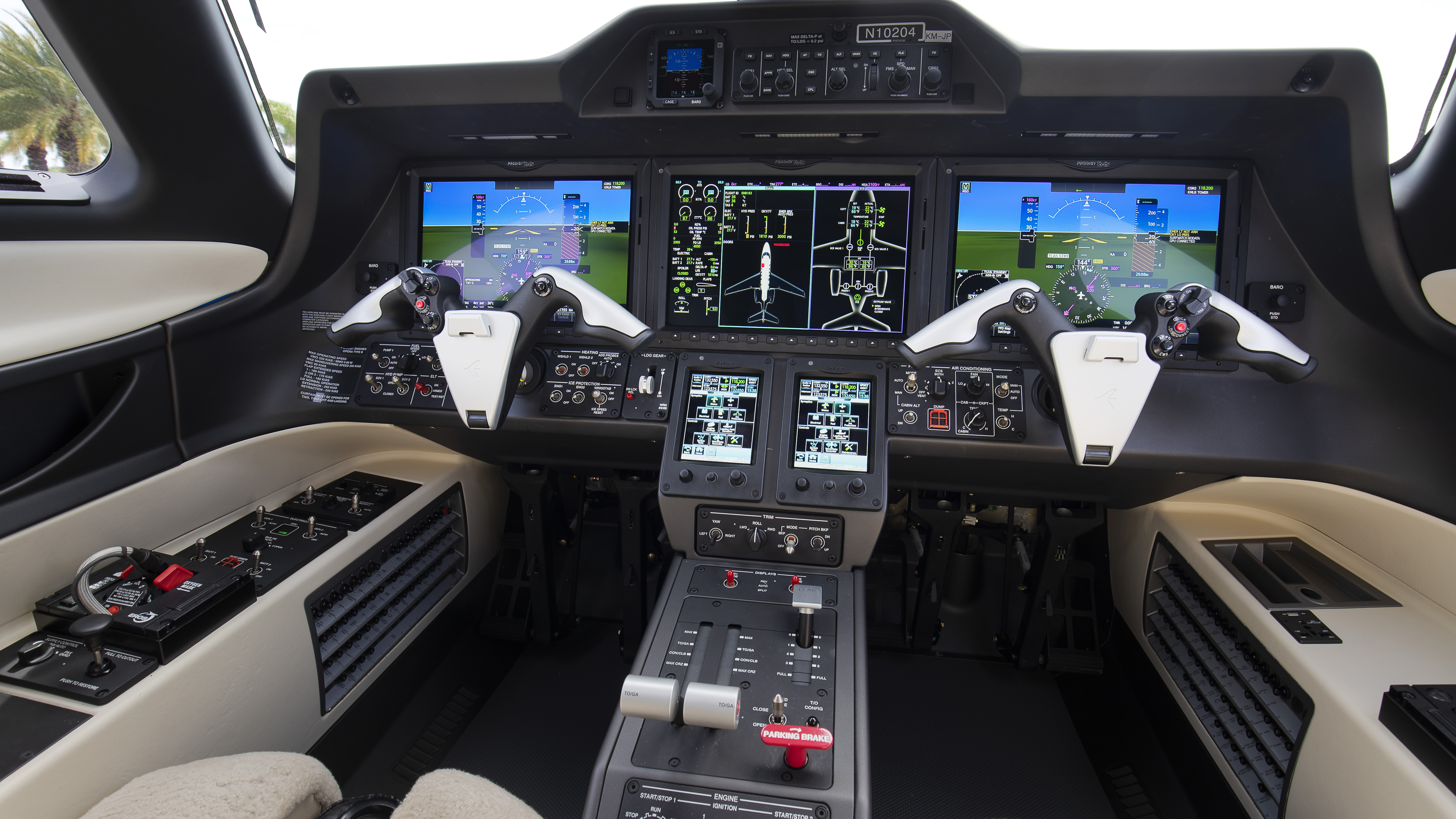 The new Phenom 300E’s cockpit features the Prodigy Touch avionics suite with Garmin’s latest G3000 display screens and GTC 575 touchscreen controllers. The screens have higher resolution and faster update rates than previous versions. Thanks to a relocation of equipment on the cockpit bulkhead, the pilot seats now have longer tracks, which yield 3.5 inches more legroom. 