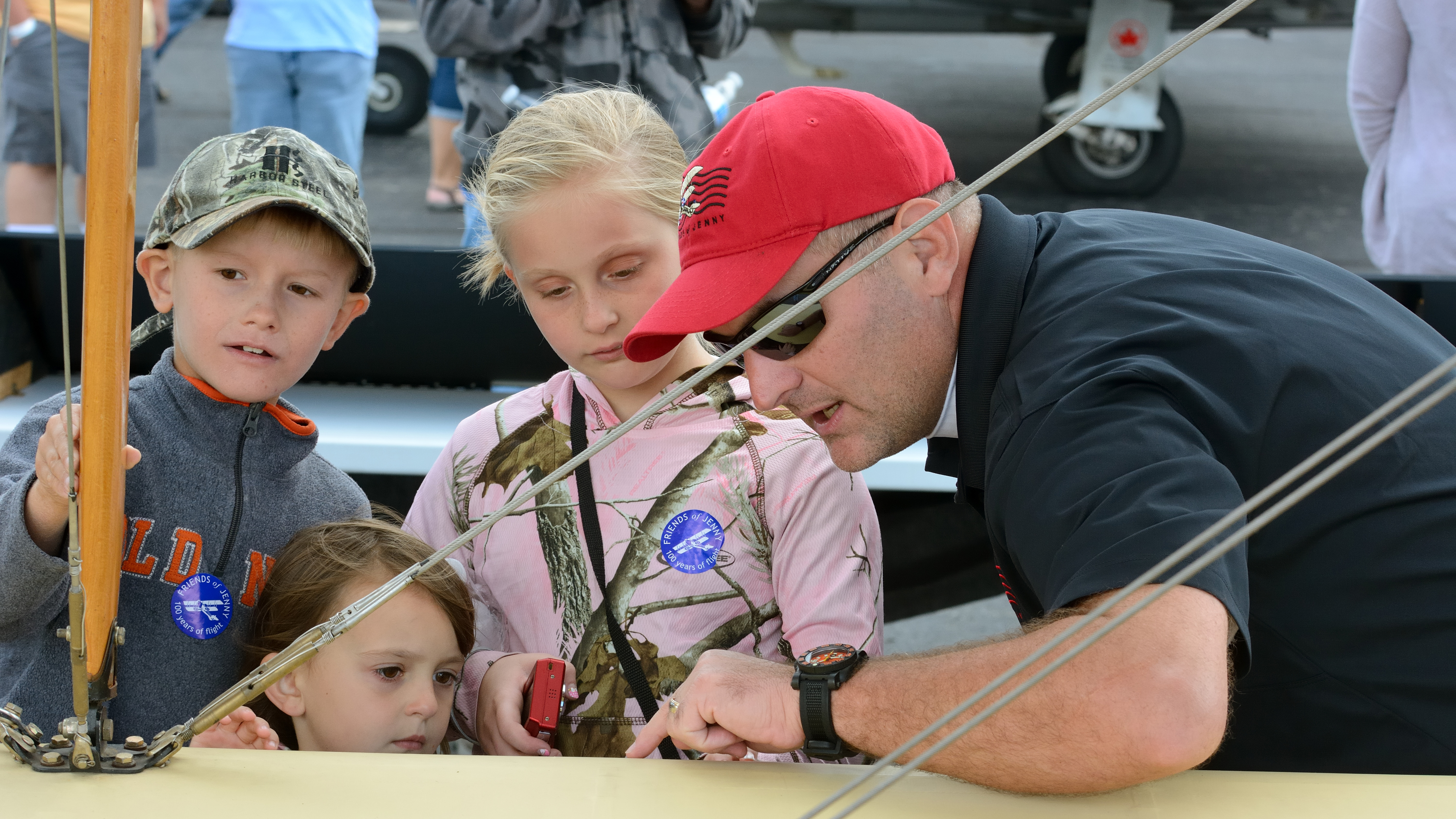 "Flying Miss Jenny," July 2016 'AOPA Pilot': It’s always gratifying to see young people introduced to aviation, and Chuck Coppinger's explanation of rib stitching was excellent. He volunteered for Kentucky-based Friends of Jenny, which restored and operated a Curtiss JN–4 Jenny replica to preserve the history of barnstorming, World War I pilot training, and early air mail. (Nikon D7100, 70 mm, 1/320, f/7.1, ISO 400)