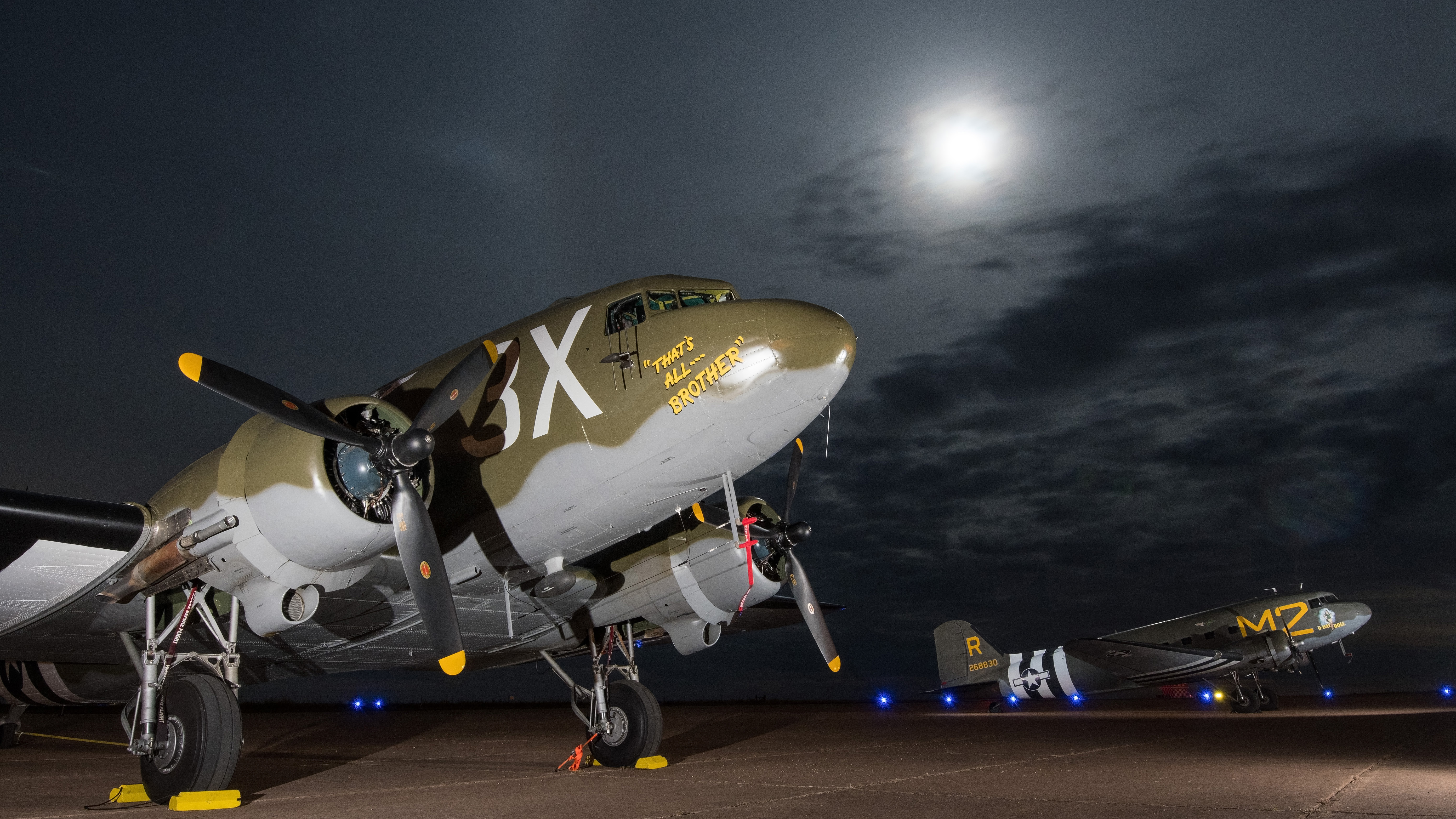 "Re-Living History", February 2019 'AOPA Pilot': It was a privilege to do a story on the World War II Airborne Demonstration Team as members trained for the seventy-fifth anniversary of D-Day. Special guests in Frederick, Oklahoma, for part of that week were these two D-Day veterans, owned and operated by the Commemorative Air Force—That's All, Brother (left) led the paratrooper drops in support of the Normandy invasion. If these two historic aircraft could talk, what would they say? ADT members relished the opportunity to jump from such iconic aircraft. (Nikon D500, 16 mm, 30 sec, f/13, ISO 400)