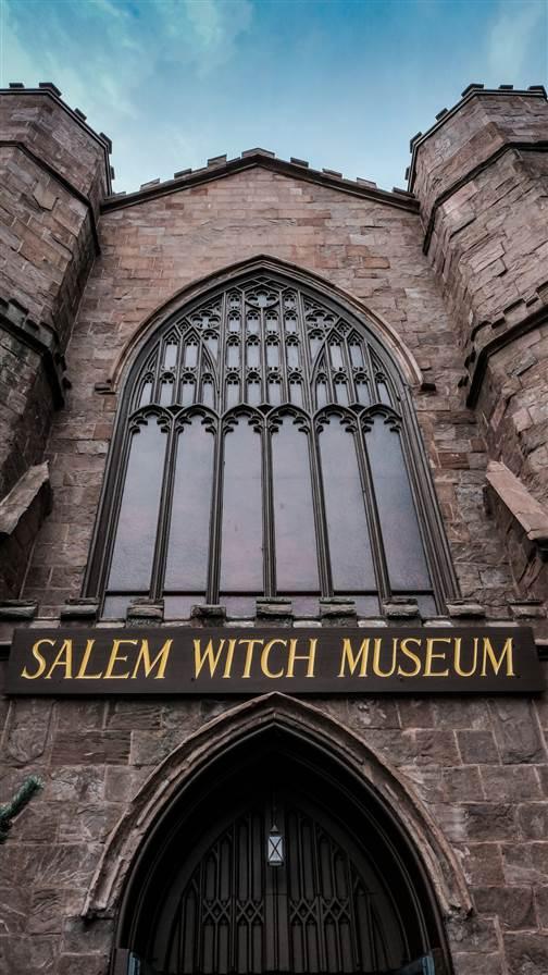 The Gothic-style building and entrance lead into the Salem Witch Museum, a popular tourist attraction. The area is famous for the so-called Salem witch trials and this museum offers visitors education and the history of the area.