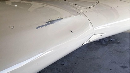 The dirty bird’s impact not only created a large dent, it also caused a hole—but strangely, with the metal tines protruding outward, rather than inward as one might expect from something impacting it from the outside. 