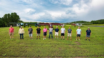 Members of the STOL Bandits pose with their airplanes at the Collegedale, Tennessee, Municipal Airport.