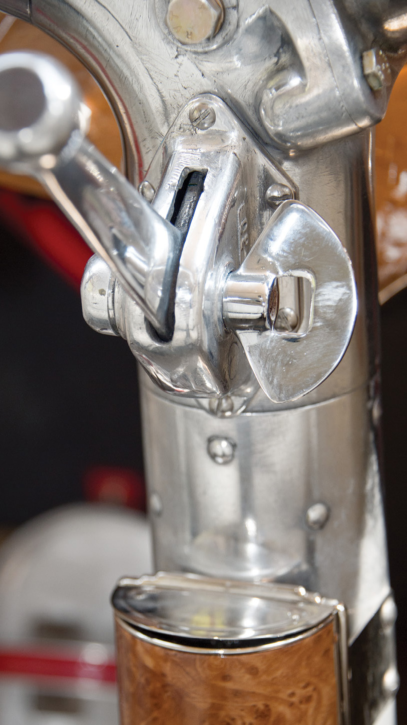 The massive castings of the throttle assembly have lasted 80 years, and of course, every pilot needs an ashtray.