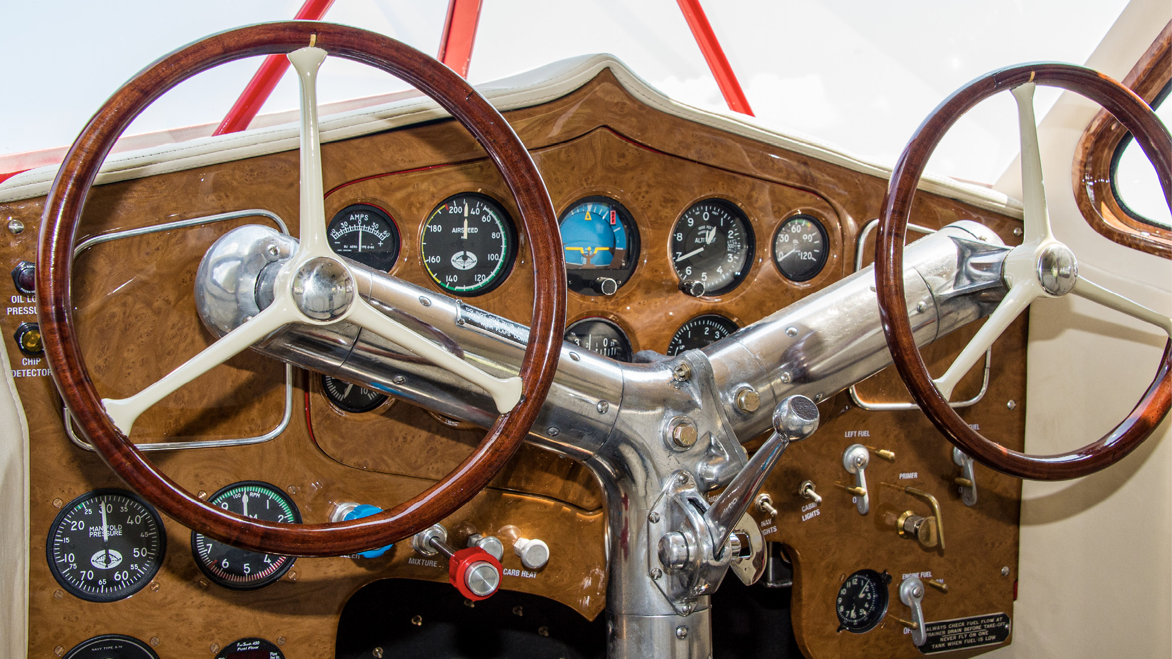 Stinson adopted a unique solution to throttle placement, putting a single massive lever on the control column where it could be reached from either seat. Prop and mixture control remains the province of the person in the left seat.