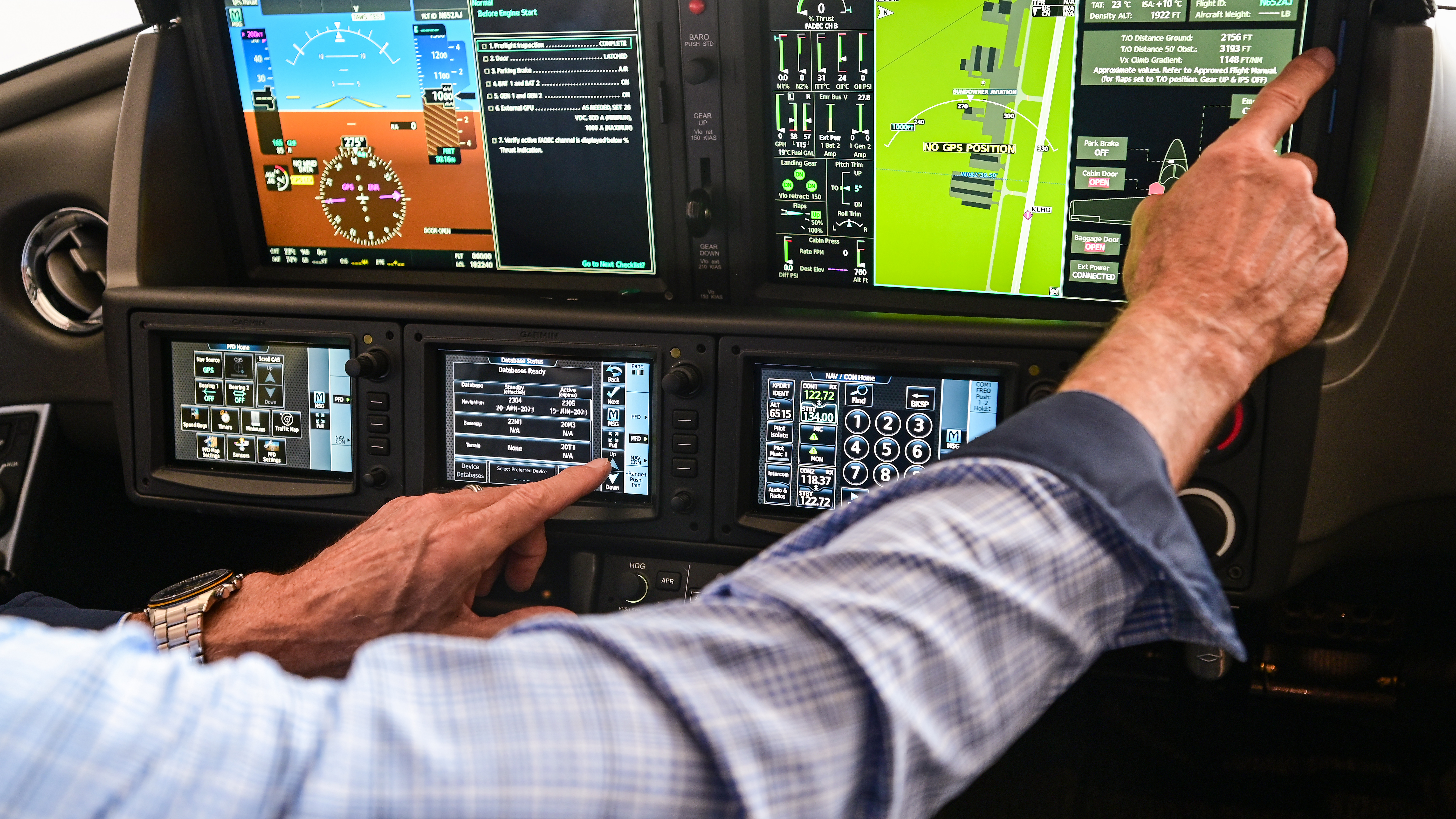Robert Masone performs his preflight and reviews departure information on the Vision Jet’s Cirrus Perspective Touch+ by Garmin. 