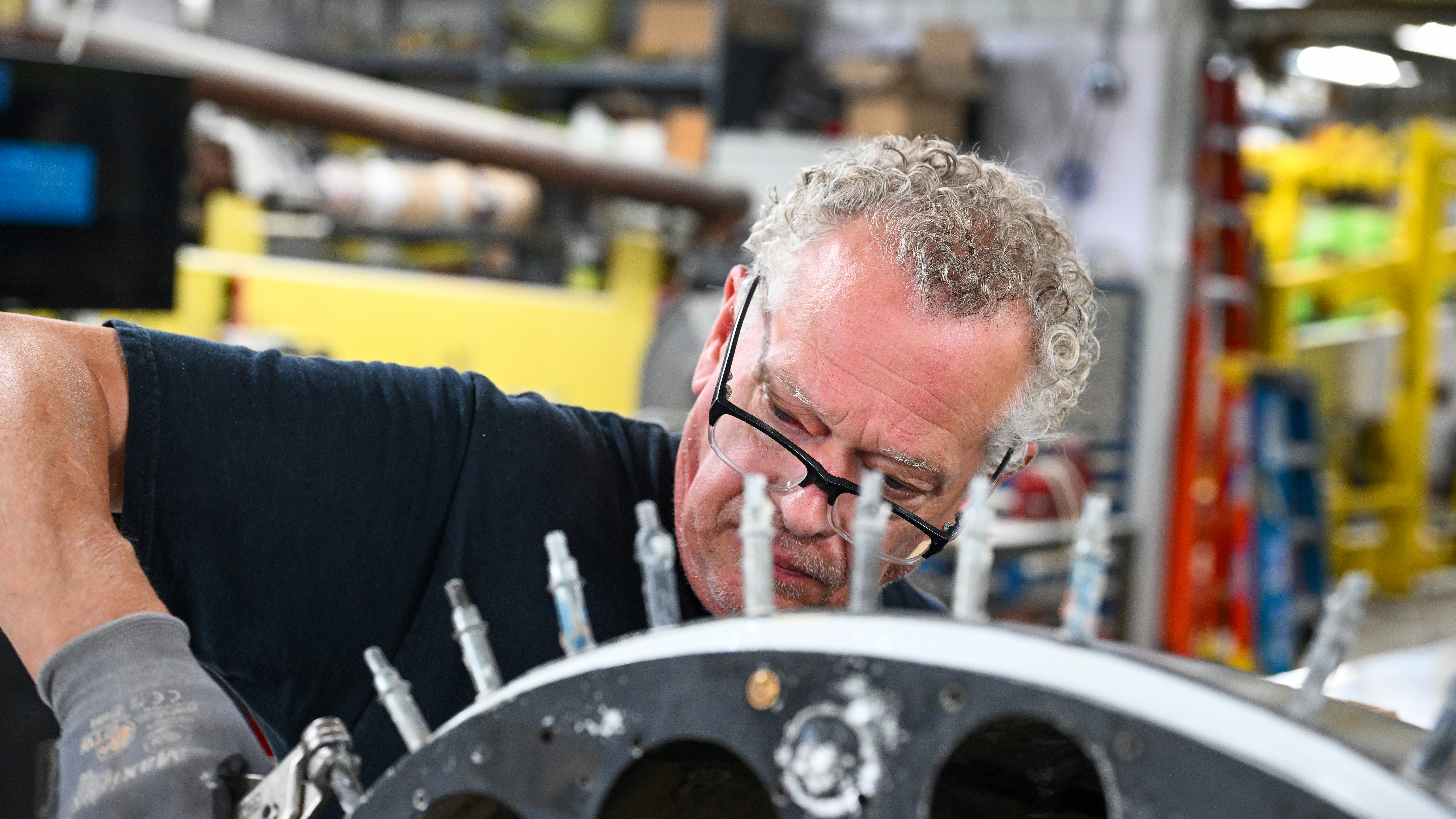 An employee working on a sailplane renovation.